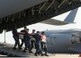AP Photo/Steve Ruark: A Navy carry team carries a transfer case containing the remains of Seaman William F. Ortega Sunday, June 20, 2010 at Dover Air Force Base, Del.